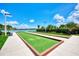 Bocce ball court with lake views, perfect for community gatherings at 11819 Sistine Ln, Venice, FL 34293