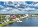 Aerial shot capturing a charming lakeside recreation area, including a boardwalk at 11819 Sistine Ln, Venice, FL 34293