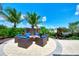 Outdoor fire pit area with comfortable seating and beautiful surroundings, ideal for relaxation at 11819 Sistine Ln, Venice, FL 34293