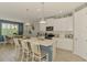 Charming kitchen with a center island, modern appliances, and lots of natural light at 11819 Sistine Ln, Venice, FL 34293
