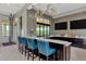 Modern kitchen features a stylish backsplash, sleek countertops, and stainless steel appliances at 11819 Sistine Ln, Venice, FL 34293