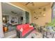 Inviting screened lanai with cozy furniture, plants, and seamless access to the interior living area at 11819 Sistine Ln, Venice, FL 34293