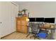 Home office with monitors, ceiling fan, and natural light at 11819 Sistine Ln, Venice, FL 34293