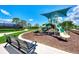Community playground featuring modern equipment and shaded seating for families at 11819 Sistine Ln, Venice, FL 34293