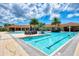Resort-style swimming pool with a spacious sun deck and inviting water features at 11819 Sistine Ln, Venice, FL 34293