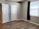 Empty bedroom with wood floors, closet, and plenty of natural light at 1271 Jonah Dr, North Port, FL 34289