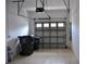 Attached garage with overhead door and storage space at 1271 Jonah Dr, North Port, FL 34289