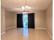 A spacious living room with tile flooring and a sliding glass door leading to the outside at 1271 Jonah Dr, North Port, FL 34289