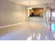 Bright living room with tile flooring and kitchen view at 1271 Jonah Dr, North Port, FL 34289