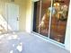 Outdoor patio with sliding glass doors and covered area at 1271 Jonah Dr, North Port, FL 34289