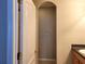 A walk-in closet features shelving and a hanging rod inside the Primary bathroom at 1271 Jonah Dr, North Port, FL 34289