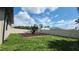 Spacious backyard featuring a playset with slide and swing, surrounded by green grass at 1480 Wise Dr, North Port, FL 34286