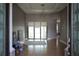 Bright foyer with tile flooring, decorative lighting, and views of the open living area at 1480 Wise Dr, North Port, FL 34286