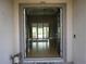 Open foyer with tile flooring, decorative lighting, and views of the living area at 1480 Wise Dr, North Port, FL 34286