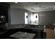 Kitchen with granite counters, a modern sink, and view into the living space at 1480 Wise Dr, North Port, FL 34286