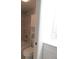 Bathroom featuring a shower over tub and storage cabinet at 150 Harborside Ave # 124, Punta Gorda, FL 33950