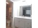 Bathroom featuring a vanity, mirror, and toilet at 150 Harborside Ave # 124, Punta Gorda, FL 33950