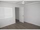 Bedroom with a ceiling fan and neutral decor at 150 Harborside Ave # 124, Punta Gorda, FL 33950