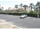 View of the community parking lot near the building at 150 Harborside Ave # 124, Punta Gorda, FL 33950