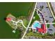 Aerial view of community with pool, clubhouse, pond, and manicured walking paths at 17213 Bullhorn Cir, Punta Gorda, FL 33982