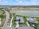 Lakefront property with a meticulously maintained lawn and scenic views of the surrounding community at 17213 Bullhorn Cir, Punta Gorda, FL 33982