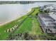 Lakefront property offering a large backyard with a screened-in pool and lush landscaping at 17213 Bullhorn Cir, Punta Gorda, FL 33982