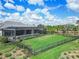 Expansive backyard showcasing a screened-in pool, well-maintained lawn, and stylish outdoor living space at 17213 Bullhorn Cir, Punta Gorda, FL 33982