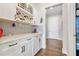 Butler pantry with wine rack, cabinetry, and beverage refrigerator at 17213 Bullhorn Cir, Punta Gorda, FL 33982