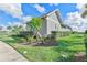Well-maintained home featuring manicured landscaping, a pristine lawn, and a charming architectural style at 17213 Bullhorn Cir, Punta Gorda, FL 33982