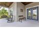 The front porch has a porch swing and rocking chairs, offering a comfortable space to unwind and enjoy the neighborhood views at 17213 Bullhorn Cir, Punta Gorda, FL 33982