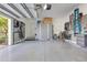 Organized garage featuring storage solutions, including cabinets and wall racks, for efficient storage and a clutter-free space at 17213 Bullhorn Cir, Punta Gorda, FL 33982