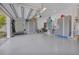 Spacious garage with ample storage cabinets and a well-organized wall-mounted system, providing a clean and functional space at 17213 Bullhorn Cir, Punta Gorda, FL 33982
