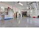 Spacious garage with epoxy flooring, custom cabinets and hanging storage at 17213 Bullhorn Cir, Punta Gorda, FL 33982