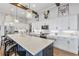 Spacious kitchen with large quartz island and modern lighting at 17213 Bullhorn Cir, Punta Gorda, FL 33982