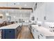 Bright kitchen with white cabinets, large island, and stainless steel appliances at 17213 Bullhorn Cir, Punta Gorda, FL 33982