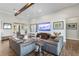 Bright living room with a large TV, stylish decor, and inviting seating, perfect for relaxing or entertaining guests at 17213 Bullhorn Cir, Punta Gorda, FL 33982