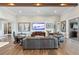 Open-concept living room with wood floors, comfortable seating, and stylish decor, ideal for entertaining at 17213 Bullhorn Cir, Punta Gorda, FL 33982