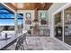 A luxury outdoor kitchen with stainless steel appliances, a built-in grill, and ample counter space at 17213 Bullhorn Cir, Punta Gorda, FL 33982