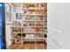 Walk-in pantry with wooden shelving and ample storage space at 17213 Bullhorn Cir, Punta Gorda, FL 33982