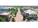 Street view of new homes with solar panels, sidewalks, and meticulously landscaped streetscape at 17213 Bullhorn Cir, Punta Gorda, FL 33982