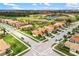 Overhead view capturing a well-planned community, manicured lawns, and serene water features at 181 Padova Way # 19, Nokomis, FL 34275