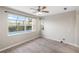 Bedroom with a large window overlooking the pool at 181 Padova Way # 19, Nokomis, FL 34275
