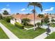 Well-maintained single Gathering home featuring a lush green lawn and mature landscaping at 181 Padova Way # 19, Nokomis, FL 34275