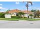 Beautiful corner lot home with well-maintained lawn, mature landscaping, and a tile roof at 181 Padova Way # 19, Nokomis, FL 34275