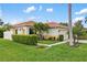 Well-maintained single-story home showcases a beautiful tile roof, lush landscaping, and a manicured lawn at 181 Padova Way # 19, Nokomis, FL 34275