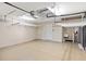 Clean and well-lit garage featuring built-in storage racks and utility sink area at 181 Padova Way, Nokomis, FL 34275