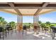 Expansive covered patio with plenty of seating and a scenic view of the golf course at 181 Padova Way # 19, Nokomis, FL 34275