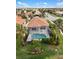 Beautiful pool with screened enclosure and lush landscaping, perfect for enjoying the outdoors in privacy at 181 Padova Way # 19, Nokomis, FL 34275