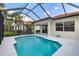 Relaxing screened-in pool area, perfect for enjoying the outdoors in a private backyard setting at 181 Padova Way # 19, Nokomis, FL 34275