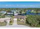 Beautiful waterfront home with lush landscaping and a private dock with ocean access in a desirable neighborhood at 18602 Ashcroft Cir, Port Charlotte, FL 33948